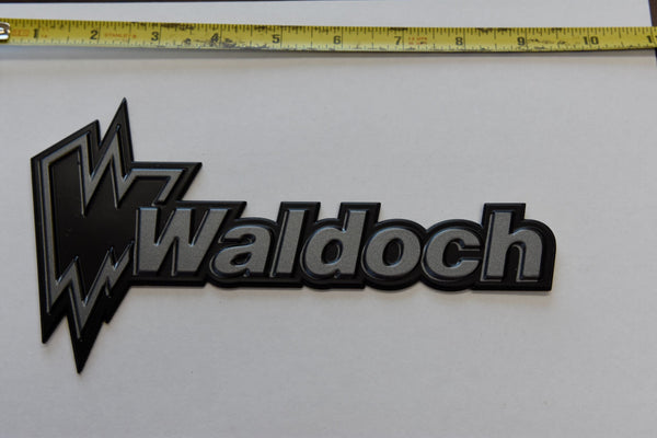 WALDOCH LOGO WITH W (SL24) BLACK BACKING WITH DARK GREY LETTERS *OR*  SILVER BACKING WITH BLACK LETTERS 4.20" X 8"